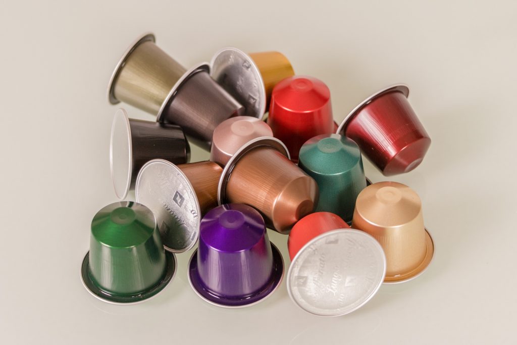 A variety of Nespresso Capsules in a pile