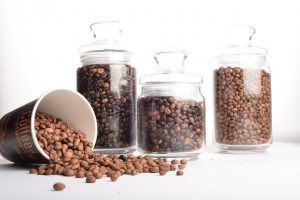 Dark Medium and Light Roast Coffee Beans in Glass Canisters