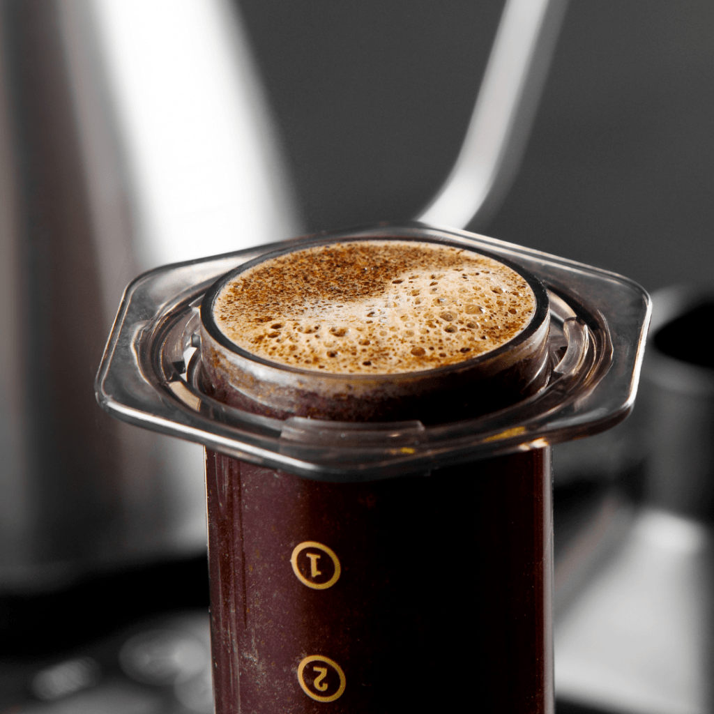 AeroPress coffee maker with brewed coffee in it